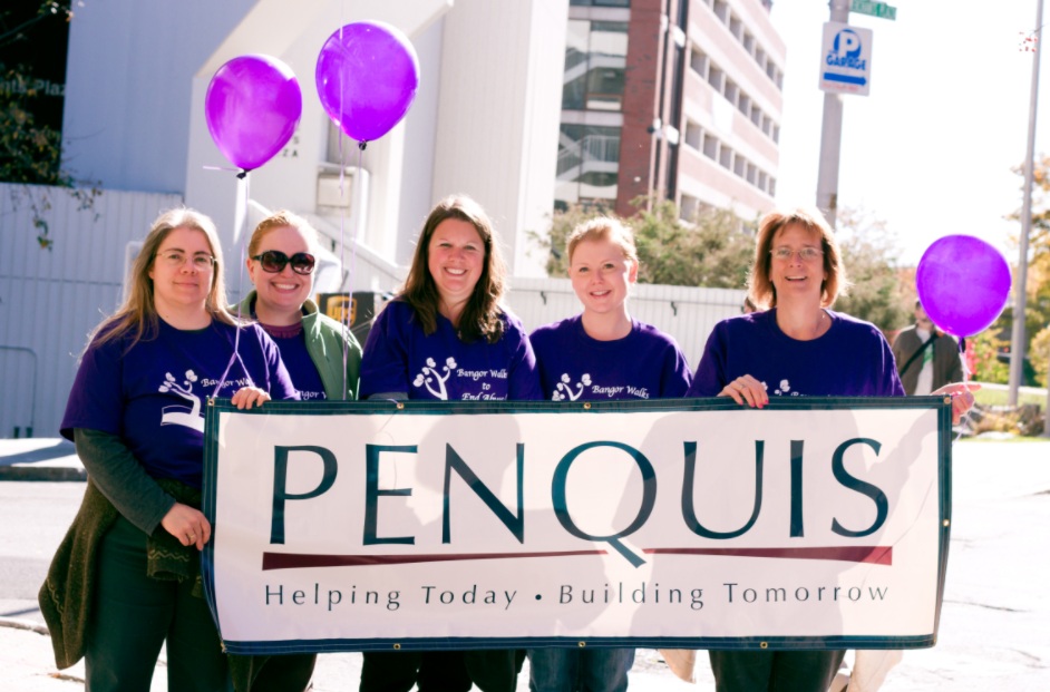 FES employees proudly representing Penquis in the Bangor Walk to End Homelessness, holding the banner high for a meaningful cause.